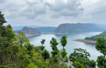 Beautiful view through the trees of the Idukki dam built across Periyar river, Idukki district, Kerala.